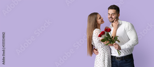 Happy young couple with bou...
