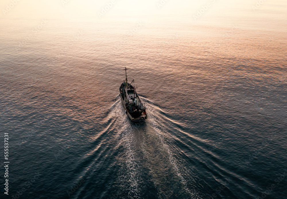 Small Fishing Boat catch fish, aerial Top View from drone. Industrial commercial fishing. - obrazy, fototapety, plakaty 