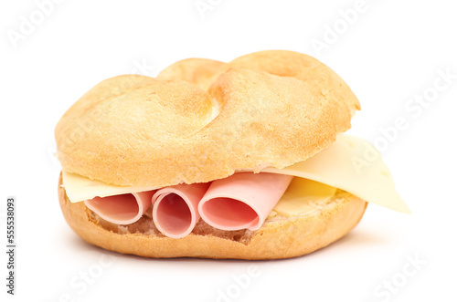 Kaiser roll with ham and cheese on white background