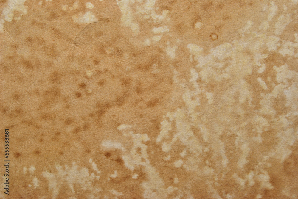 Grunge brown paper texture with stains as background Grunge brown paper texture with stains as background
