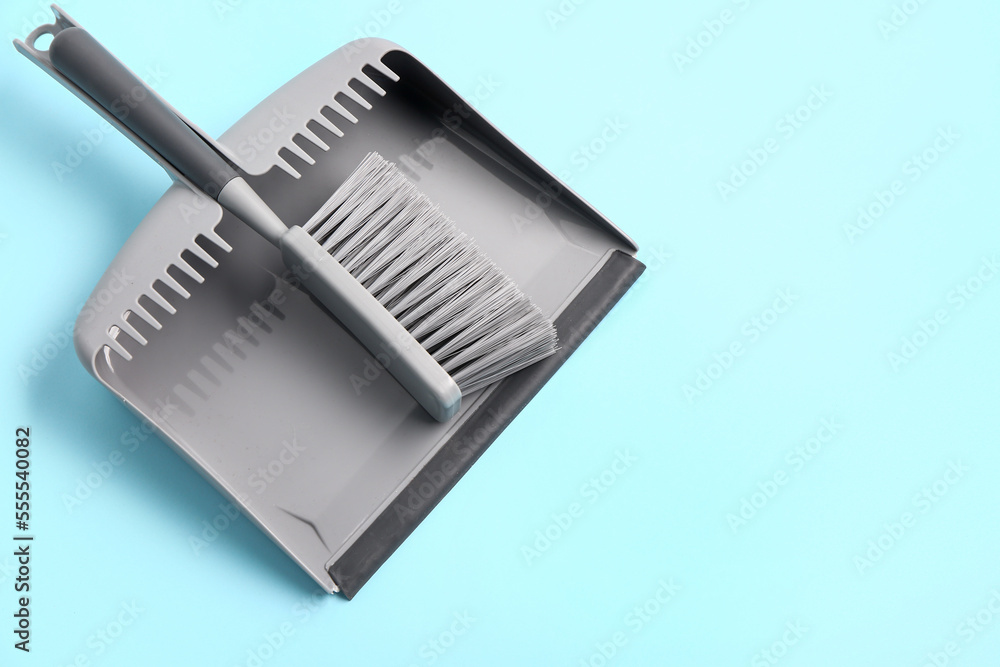 Dustpan and brush on color background Dustpan and brush on color background
