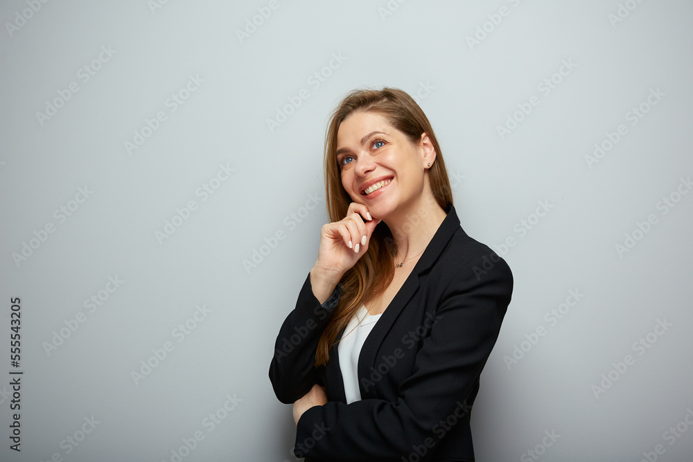 Smiling thinking business woman looking up, profile portrait with copy space. Smiling thinking business woman looking up, profile portrait with copy space.
