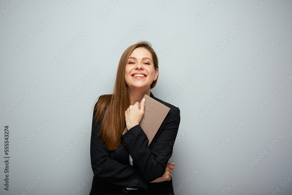 Happy woman teacher or student holding book. Isolated portrait with copy space. Happy woman teacher or student holding book. Isolated portrait with copy space.