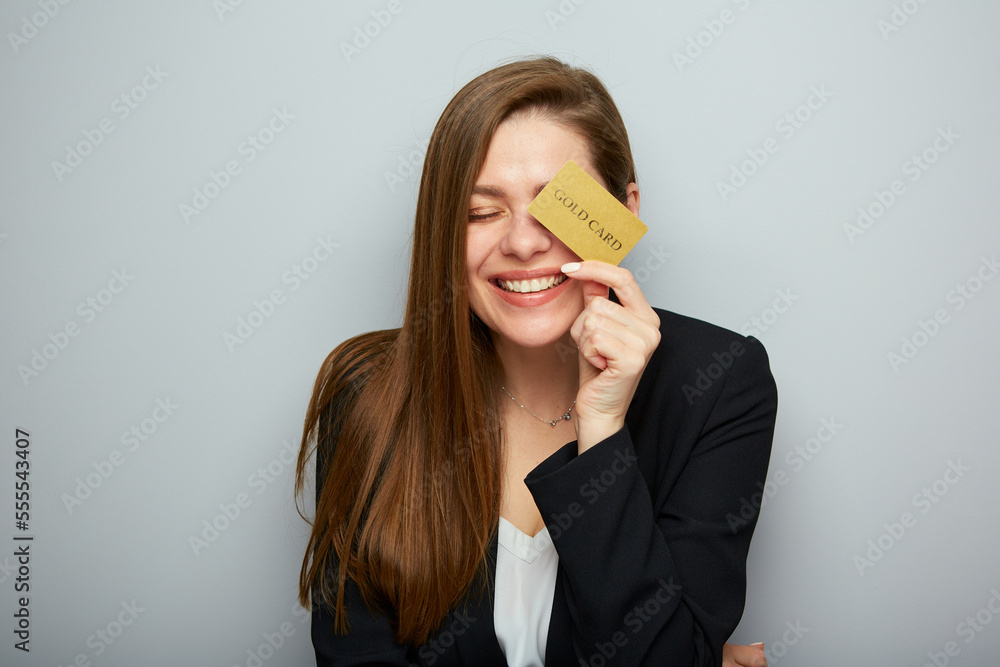 Laughing woman with closed eyes holding credit card. Isolated female portrait. Laughing woman with closed eyes holding credit card. Isolated female portrait.