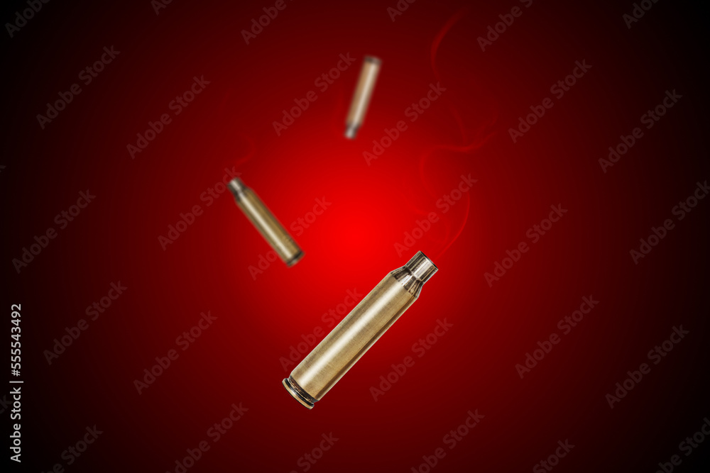 Smoking bullet assault rifle 5.56 casing shell fired out of a handgun falling down Smoking bullet assault rifle 5.56 casing shell fired out of a handgun falling down