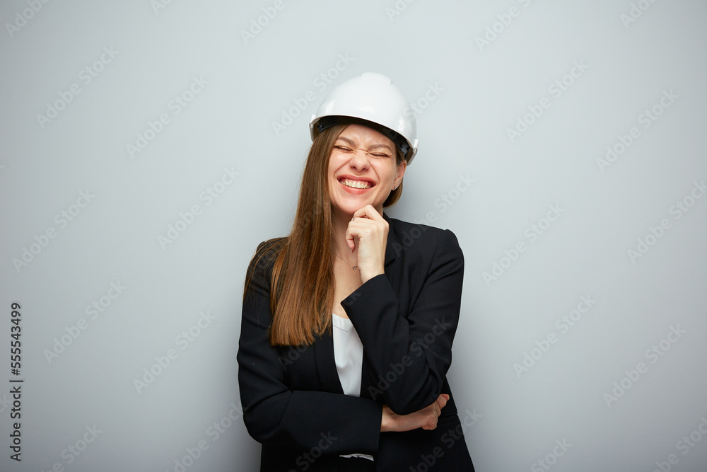 Happy woman architect in white helmet with closed eyes. Isolated female portrait. Happy woman architect in white helmet with closed eyes. Isolated female portrait.