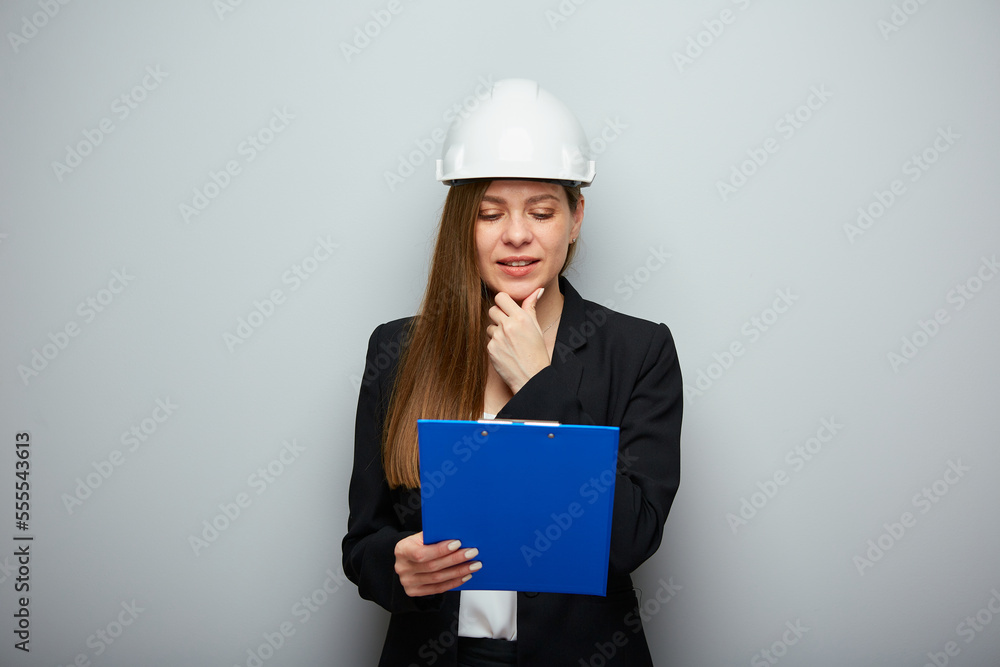 Woman architect engineer profession reading instruction book. Woman architect engineer profession reading instruction book.