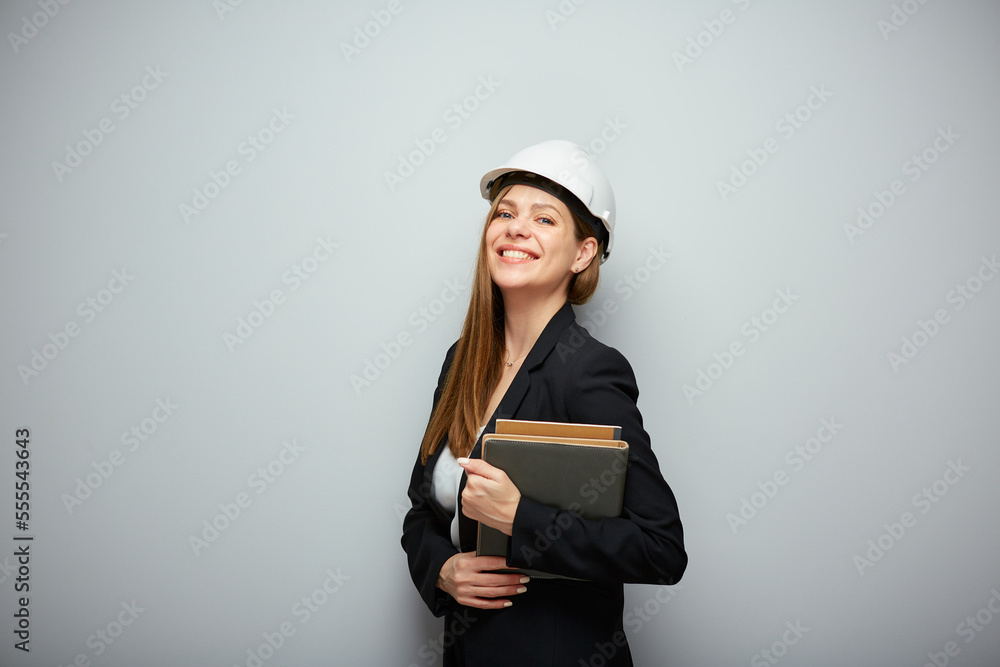 Woman student architect or engineer profession standing with book. Woman student architect or engineer profession standing with book.