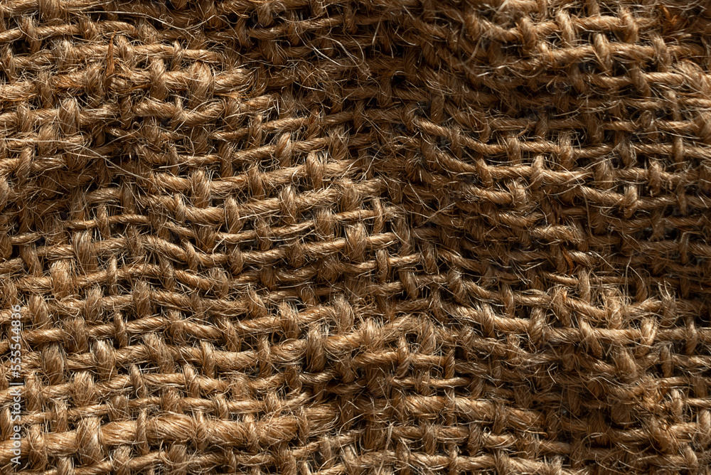 Texture of natural burlap material close-up, with natural folds and draperies Texture of natural burlap material close-up, with natural folds and draperies