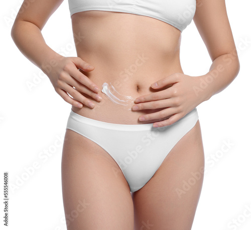 Young woman with body cream smear on belly against white background, closeup © New Africa