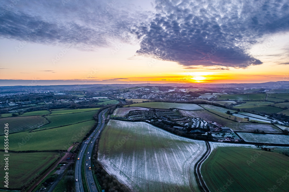 Sunset over Frosty fields and farms from a drone, Torquay, Torbay, Devon, England, Europe