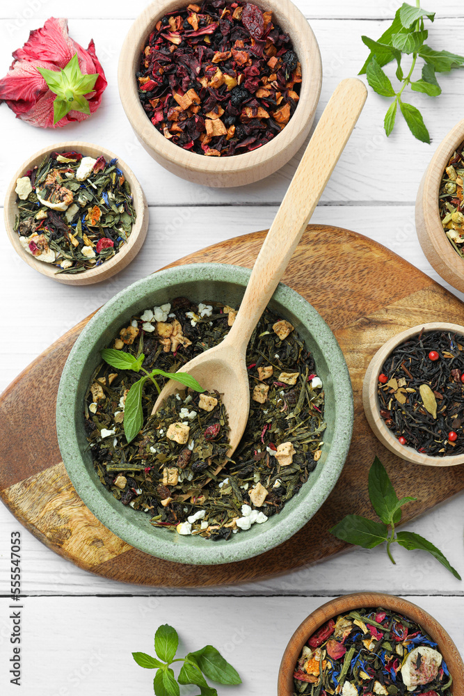 Many different herbal teas on white wooden table, flat lay Many different herbal teas on white wooden table, flat lay