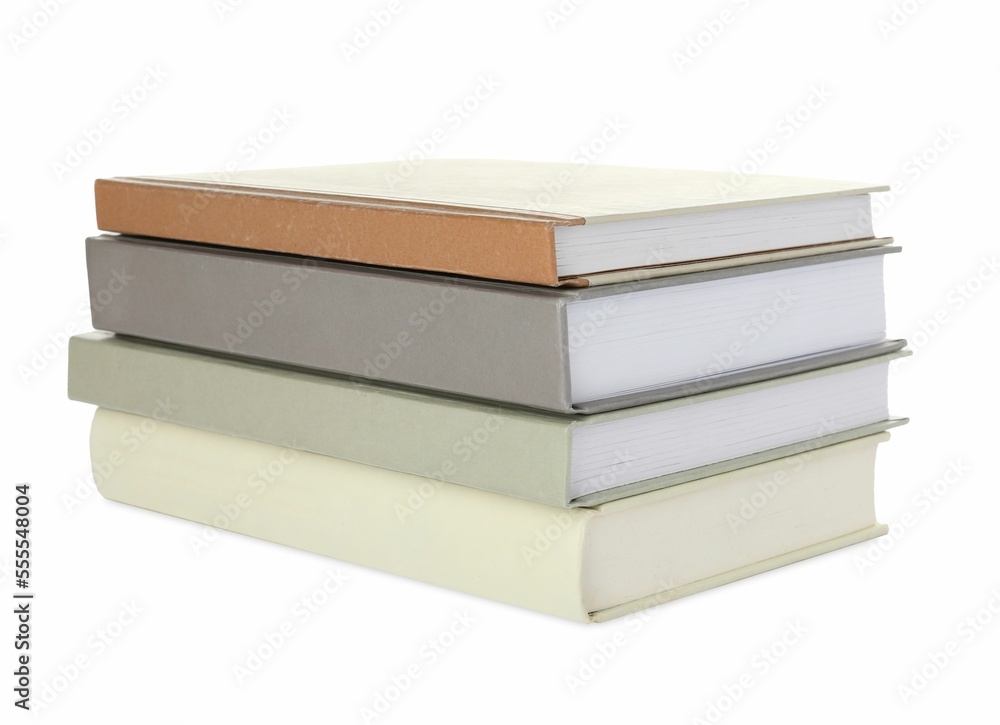 Many different books stacked on white background Many different books stacked on white background