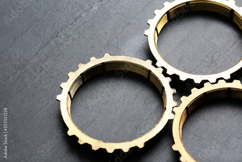 Stainless steel gears on grey background  closeup