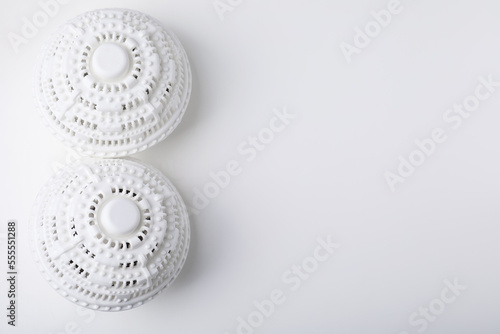 Laundry dryer balls on white table, flat lay. Space for text