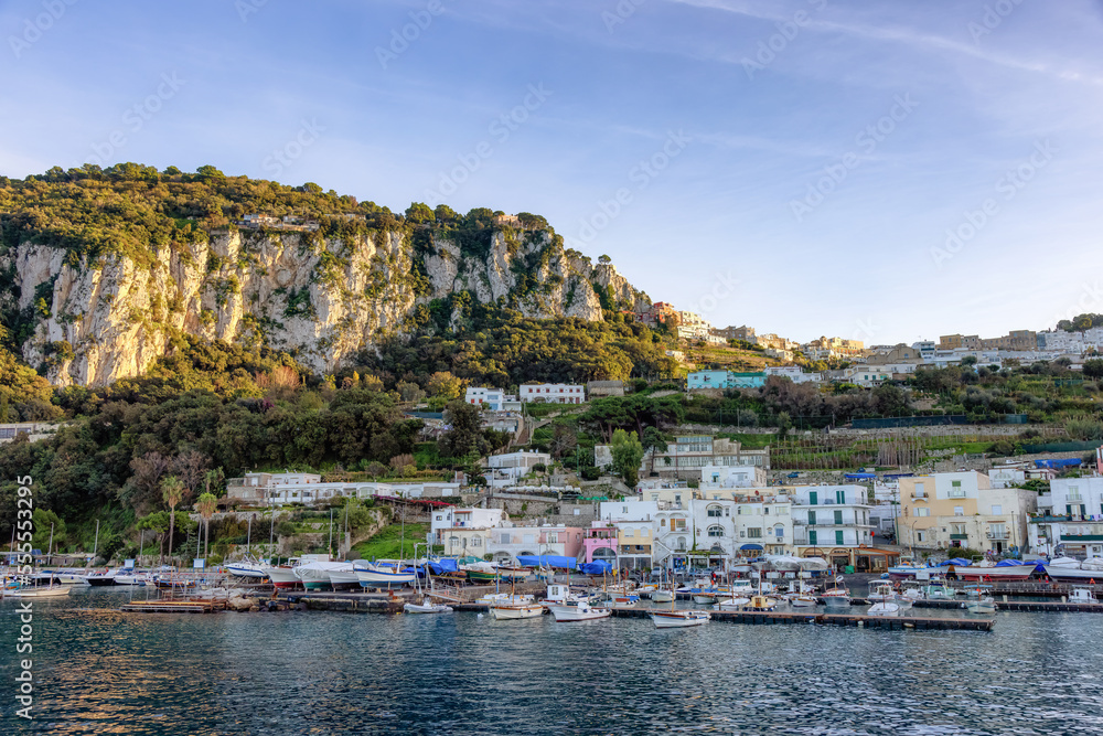 Capri Island in Bay of Naples, Italy. Sunny Evening. Town and Marina.
