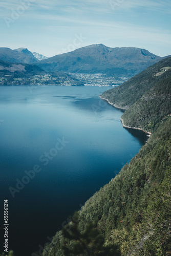 Mountains during moody weather in autumn Norway with a fjord and beautiful reflections Background © Alicia