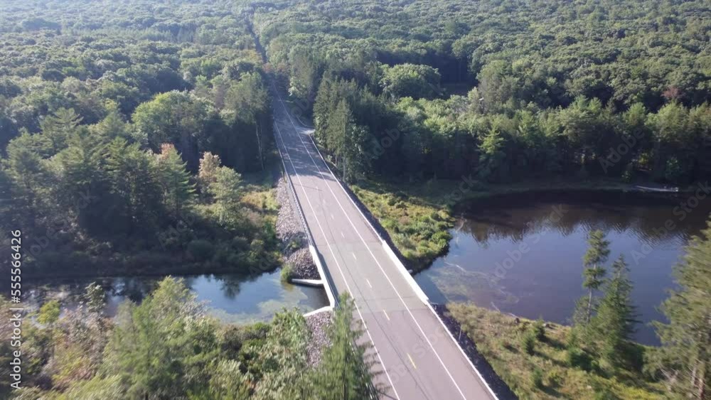 birds eye view to a rural Pennsylvania road in a forest