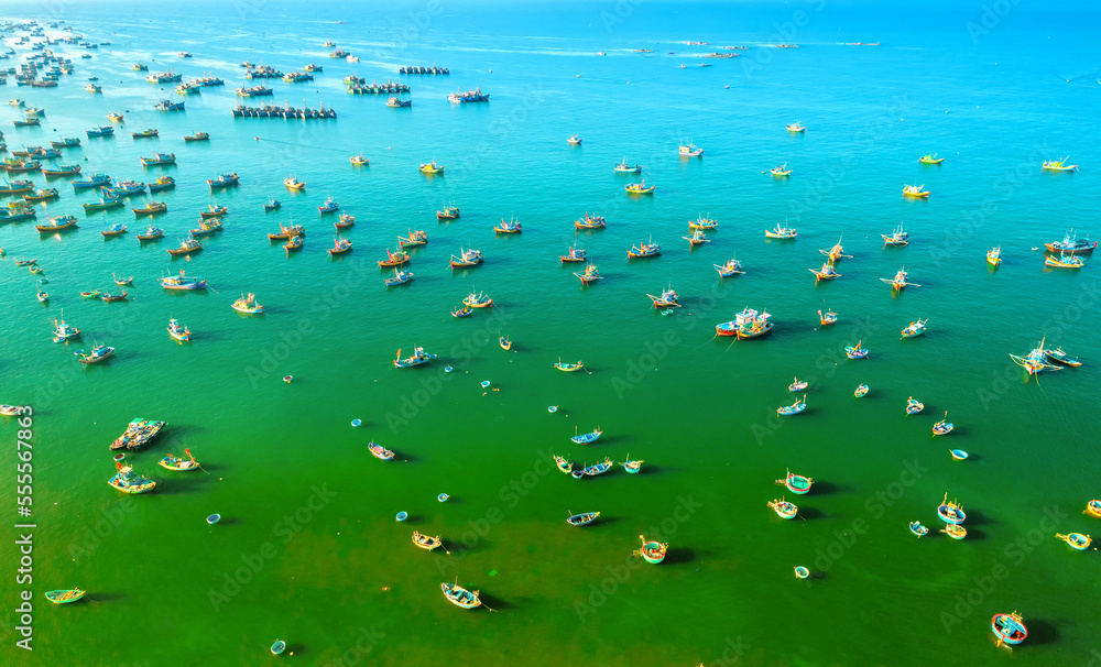 Mui Ne fishing village seen from above with hundreds of boats anchored to avoid storms, this is a beautiful bay in central Vietnam Mui Ne fishing village seen from above with hundreds of boats anchored to avoid storms, this is a beautiful bay in central Vietnam