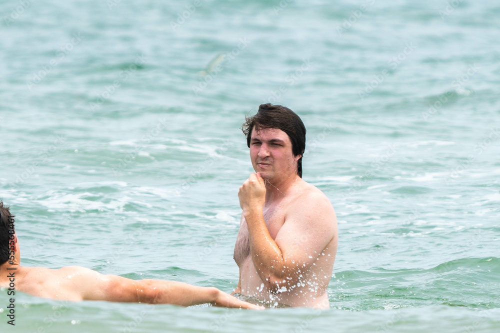 man swimming in the sea