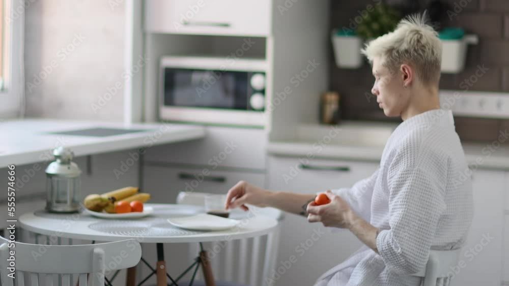 Close-up of Caucasian man in the morning in kitchen. Lifestyle, occupation, resting. 4k Close-up of Caucasian man in the morning in kitchen. Lifestyle, occupation, resting. 4k