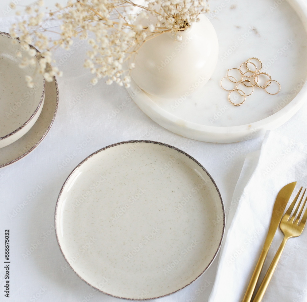 Aesthetic feminine tableware top view on white linen tablecloth with copy space. Trendy plates, cutlery and linen napkins scandinavian style.Space for text or menu. Business food brand template. Aesthetic feminine tableware top view on white linen tablecloth with copy space. Trendy plates, cutlery and linen napkins scandinavian style.Space for text or menu. Business food brand template.