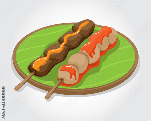 Delicious asian food sate or satay and spicy meatballs steak with stick served on banana leaf plate