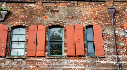 Old Red and Brown Brick ??Building with Arched Victorian Style Windows. © ttrimmer