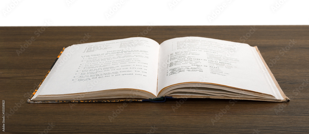 Obraz premium Open old book on wooden desk