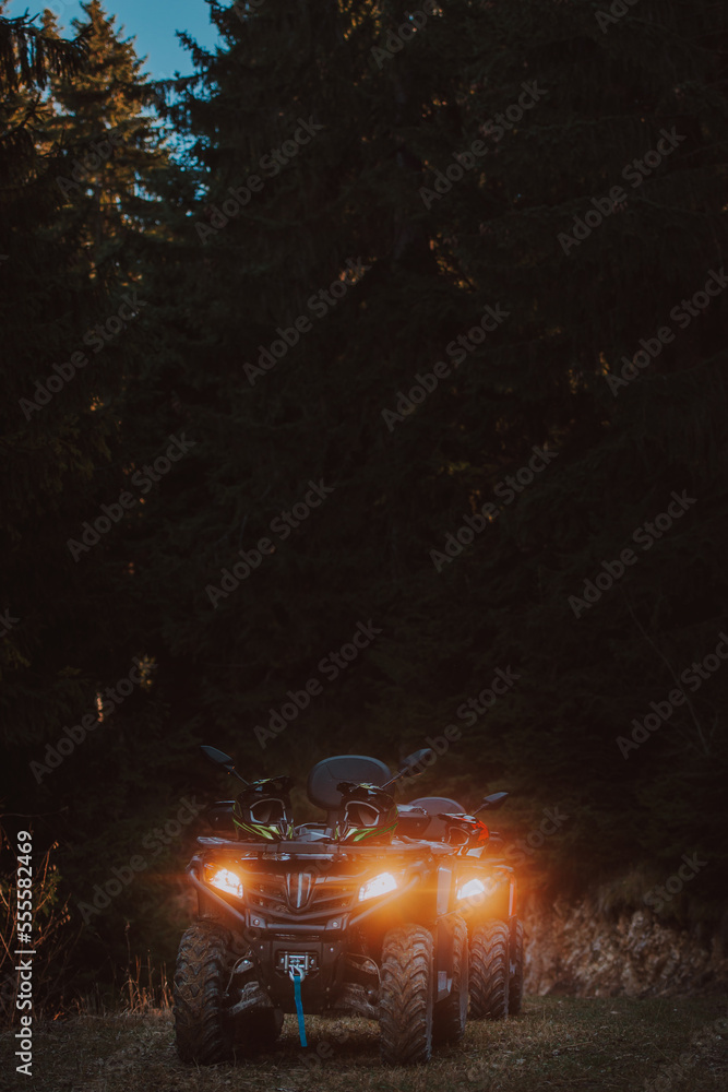 Beautiful nature landscape with ATV awd quadbike motorcycle and cloudscape sky background. Offroad adventure trip. Extreme sports activity. Front view. Concept motocross quadricycle background