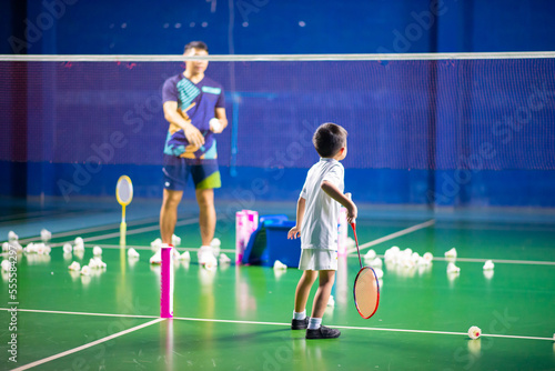 Boys training badminton indoor activitiy
