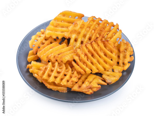 Fried Waffle Potato on black dish isolate on white with clipping path.Waffle french fried appetizer food. photo