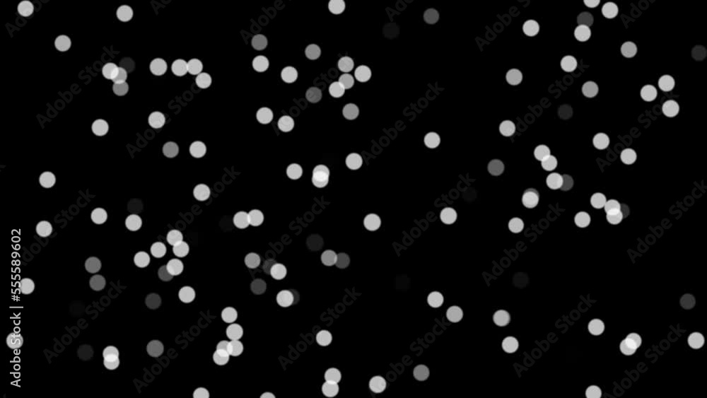 Black and white dots flowing like a Bokeh effect from your camera lens.