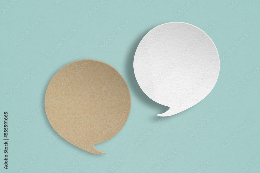 white and brown speech bubble grunge paper cut on grunge green background. Conceptual image about communication and social media, customer feedback white and brown speech bubble grunge paper cut on grunge green background. Conceptual image about communication and social media, customer feedback