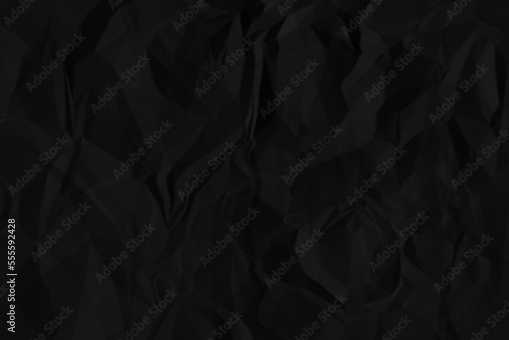 Black crumpled paper texture background. A crumpled sheet of dark gray paper abstract background. Black crumpled paper texture background. A crumpled sheet of dark gray paper abstract background.