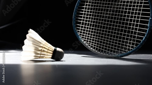 Slow motion of a Shuttlecock falling on a black background. Black background.