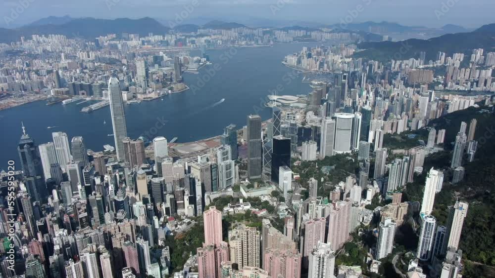 Drone above Hong Kong Victoria bay  with city skyscrapers on a beautiful day