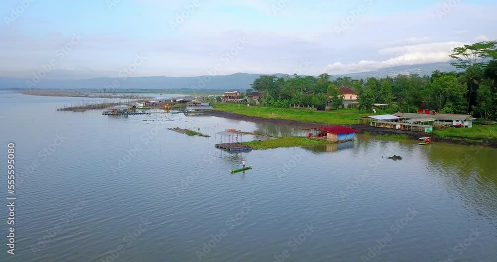 Aerial view showing fishing farm with tropical coastline at Rawa Pening Lake in Indonesia Aerial view showing fishing farm with tropical coastline at Rawa Pening Lake in Indonesia