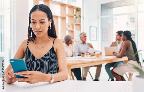 Office, technology and business woman with phone at desk for networking, social media and online research. Communication, smartphone and female worker typing, listening to music and writing email