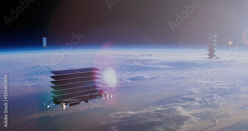 Satellite flying in high orbit of planet Earth, straightens solar panels