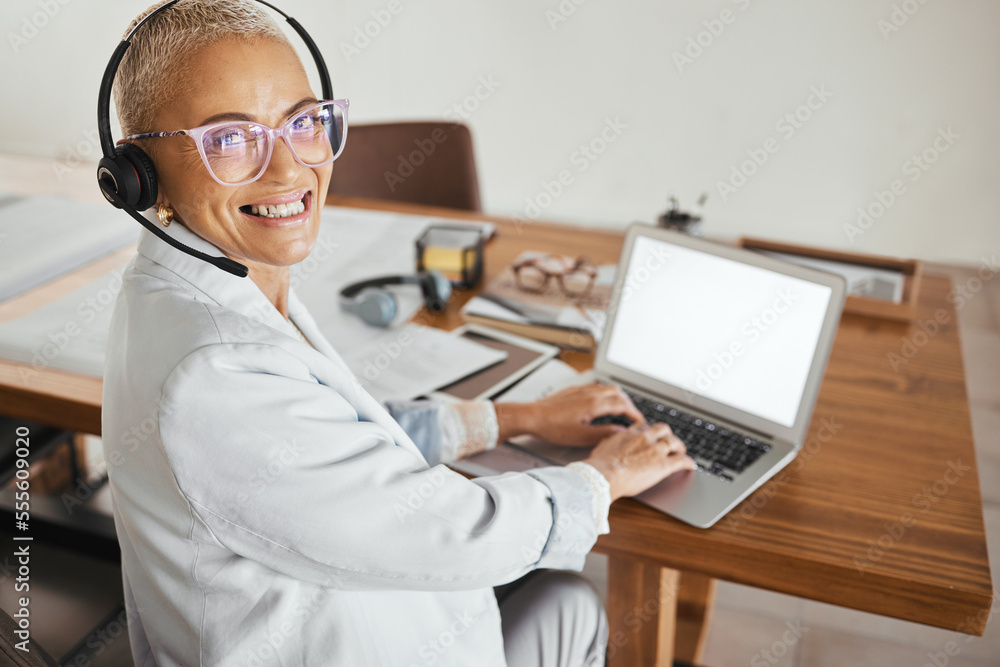 Mature business woman, laptop or call center headset in home office, telemarketing company or b2b sales startup on mockup screen. Portrait, happy smile or customer support manager on crm technology Mature business woman, laptop or call center headset in home office, telemarketing company or b2b sales startup on mockup screen. Portrait, happy smile or customer support manager on crm technology