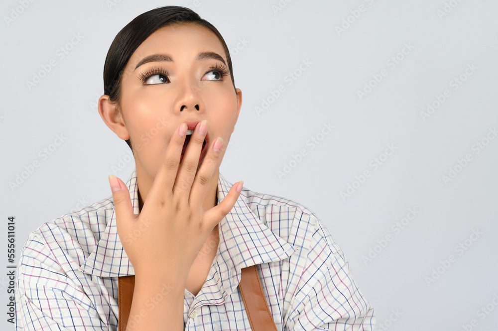 Portrait of young asian woman in waitress costume in surprise gesture Portrait of young asian woman in waitress costume in surprise gesture