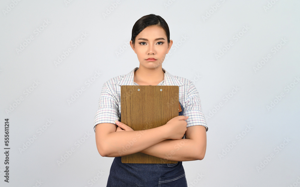 Portrait of young asian woman in waitress uniform pose with clipboard Portrait of young asian woman in waitress uniform pose with clipboard
