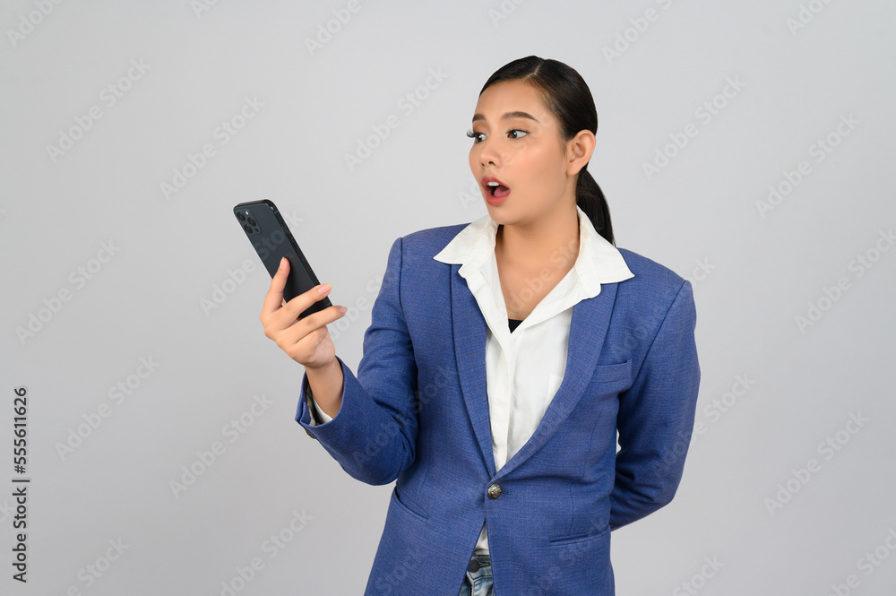 Young beautiful woman in formal clothing for officer use smartphone posture Young beautiful woman in formal clothing for officer use smartphone posture
