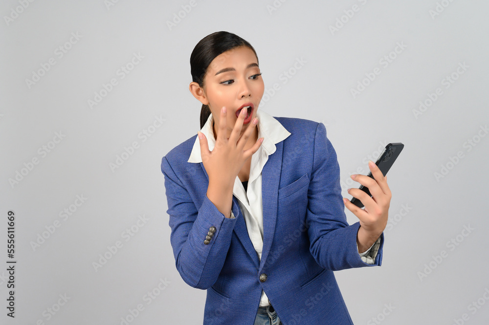 Young beautiful woman in formal clothing for officer use smartphone posture Young beautiful woman in formal clothing for officer use smartphone posture