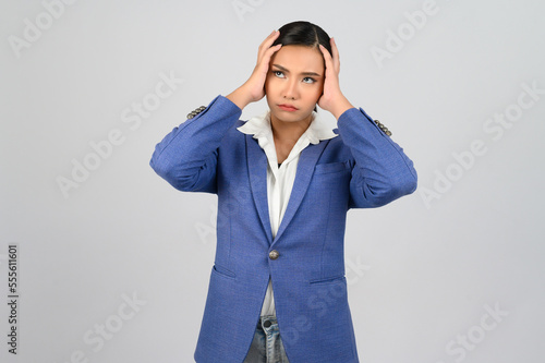 Young beautiful woman in formal clothing for officer headache posture