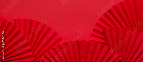 Chinese New Year 2023 .Decor pattern fan on red background. Red paper fans .Lunar New Year banner template.  Lunar New Year chinese banner