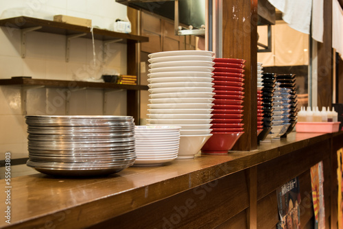 Pile of plates and bowls that will be used to serve ramen and Japanese dishes at Japanese restaurants photo