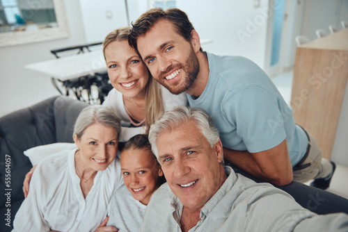 Family, selfie and grandparents with girl, parents and smile for bonding, loving and lounge. Love, portrait and grandmother with grandfather, mama and dad with daughter, happiness and relax on sofa.