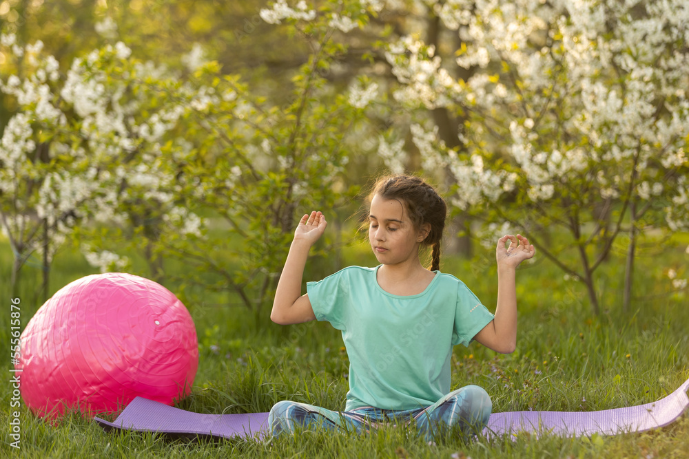child doing gymnastics exercises. Sports, learning, fitness, stretching child doing gymnastics exercises. Sports, learning, fitness, stretching